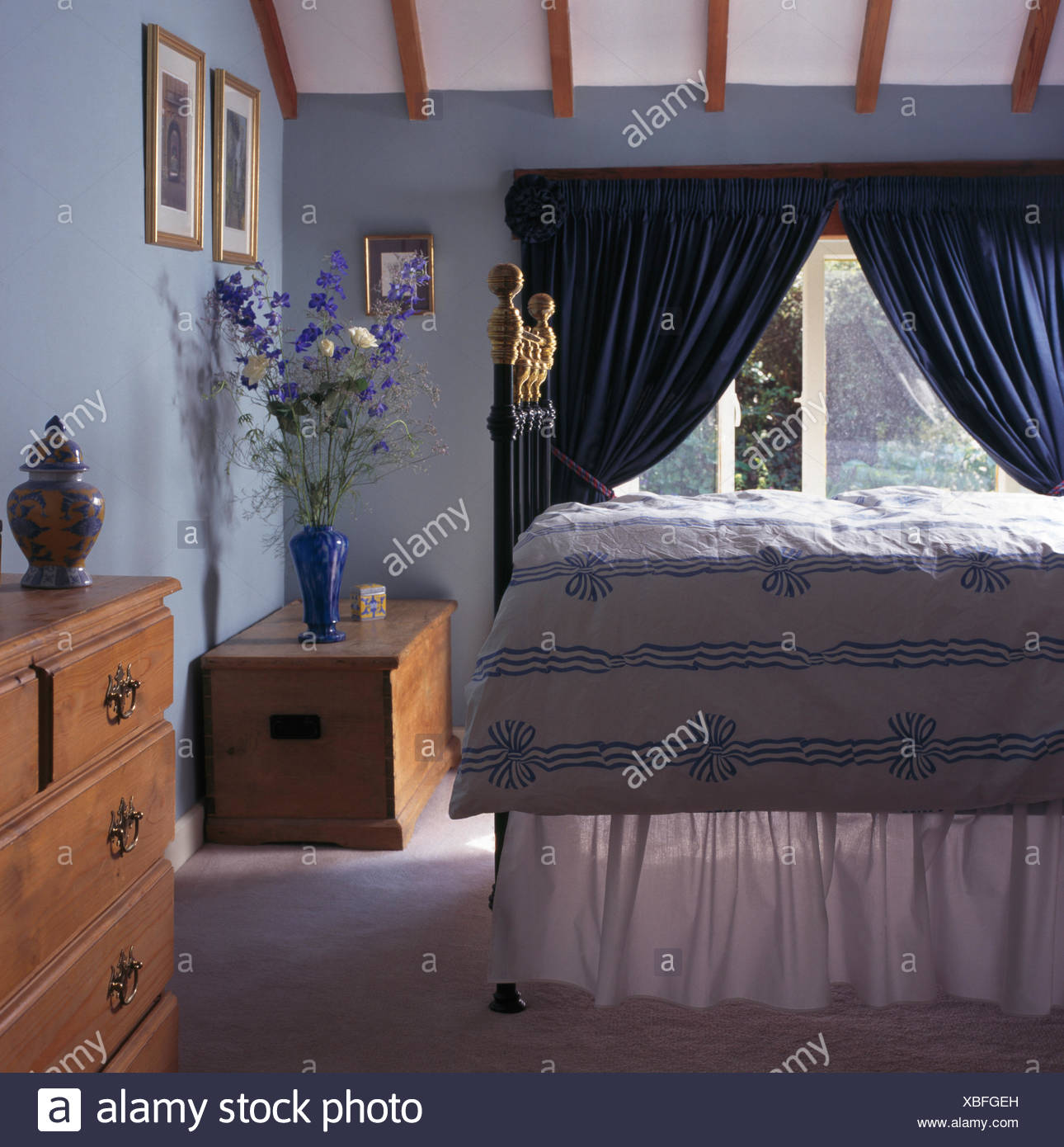 Blue White Ribbon Patterned Duvet On Brass Bed In Nineties