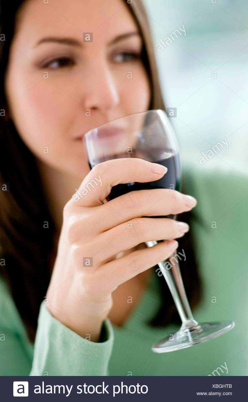 Hand Holding Red Wine Glass Stock Photos & Hand Holding Red Wine Glass