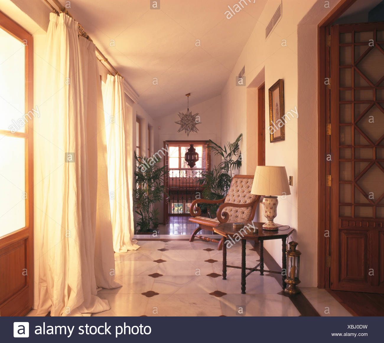 White Curtains On Glass Doors In Spanish Country Hall With A