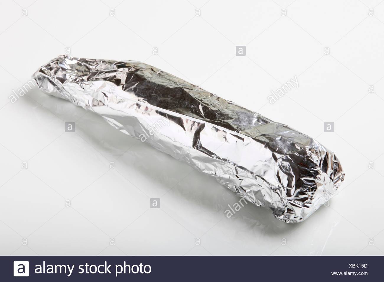 Raw Pork Tenderloin Wrapped In Aluminum Foil Stock Photo Alamy