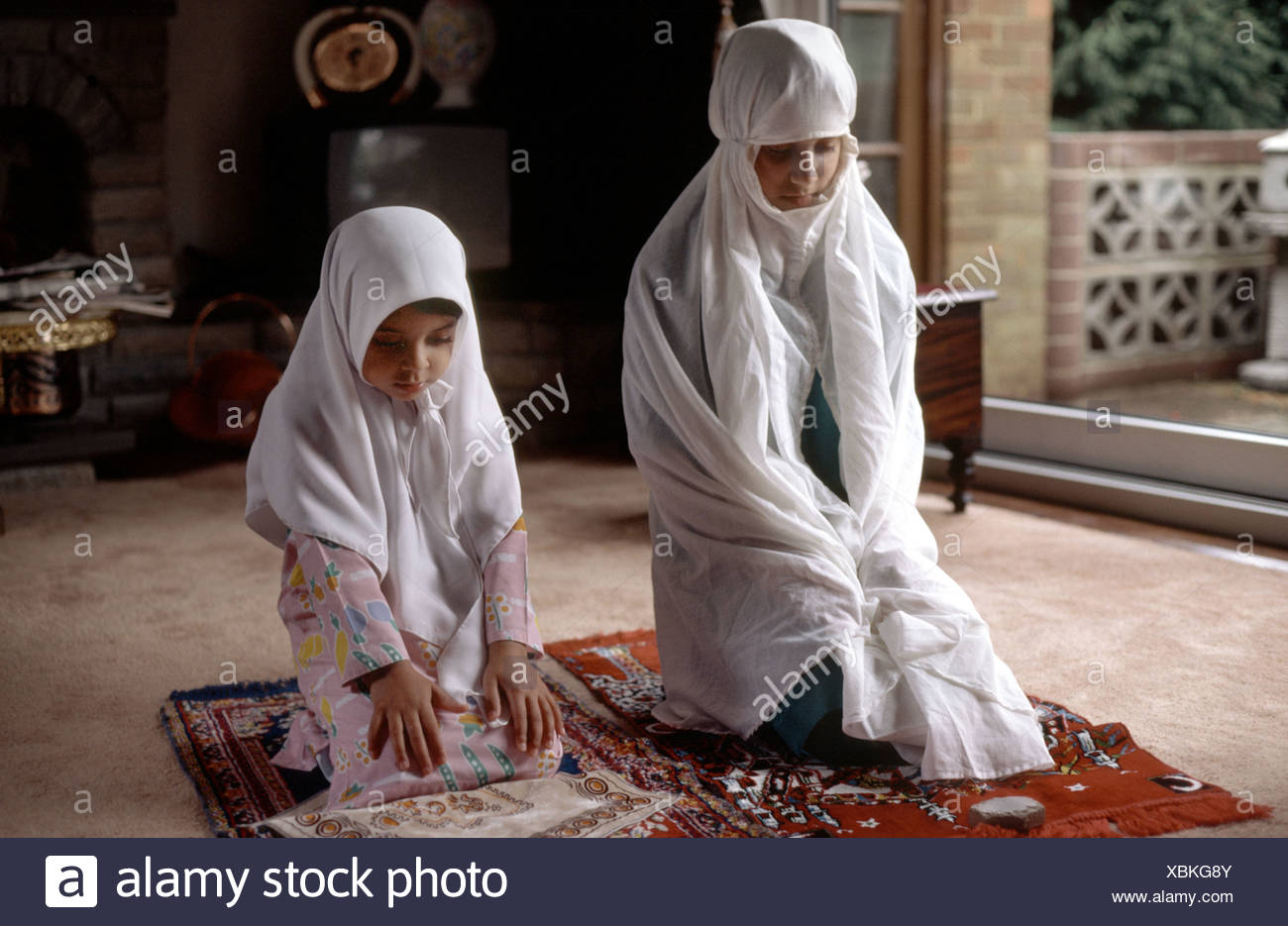 Muslim Family Praying Home In Stock Photos & Muslim Family 