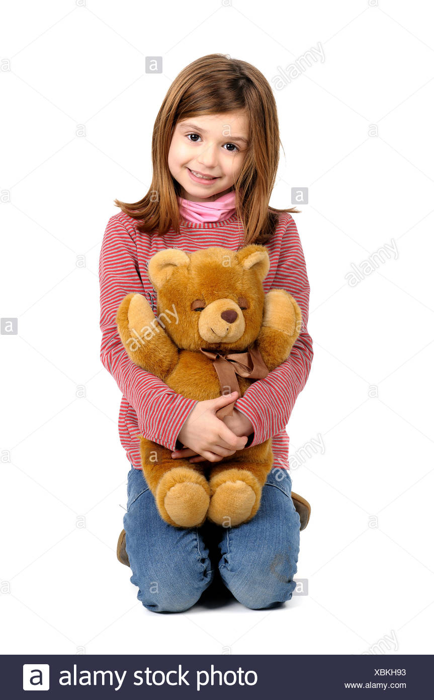 girl holding teddy bear
