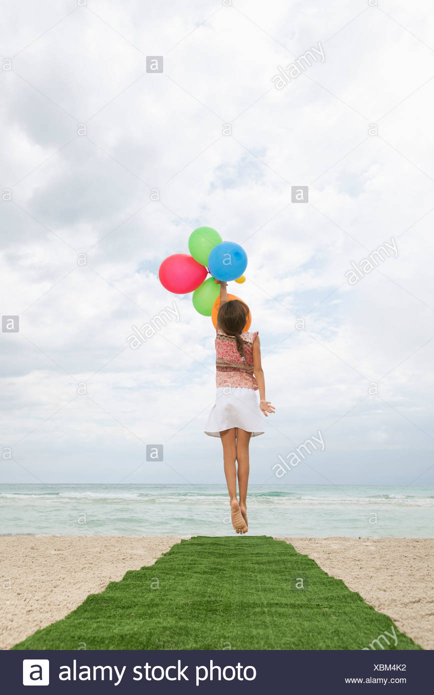 Girl Jumping In The Sea High Resolution Stock Photography and Images ...