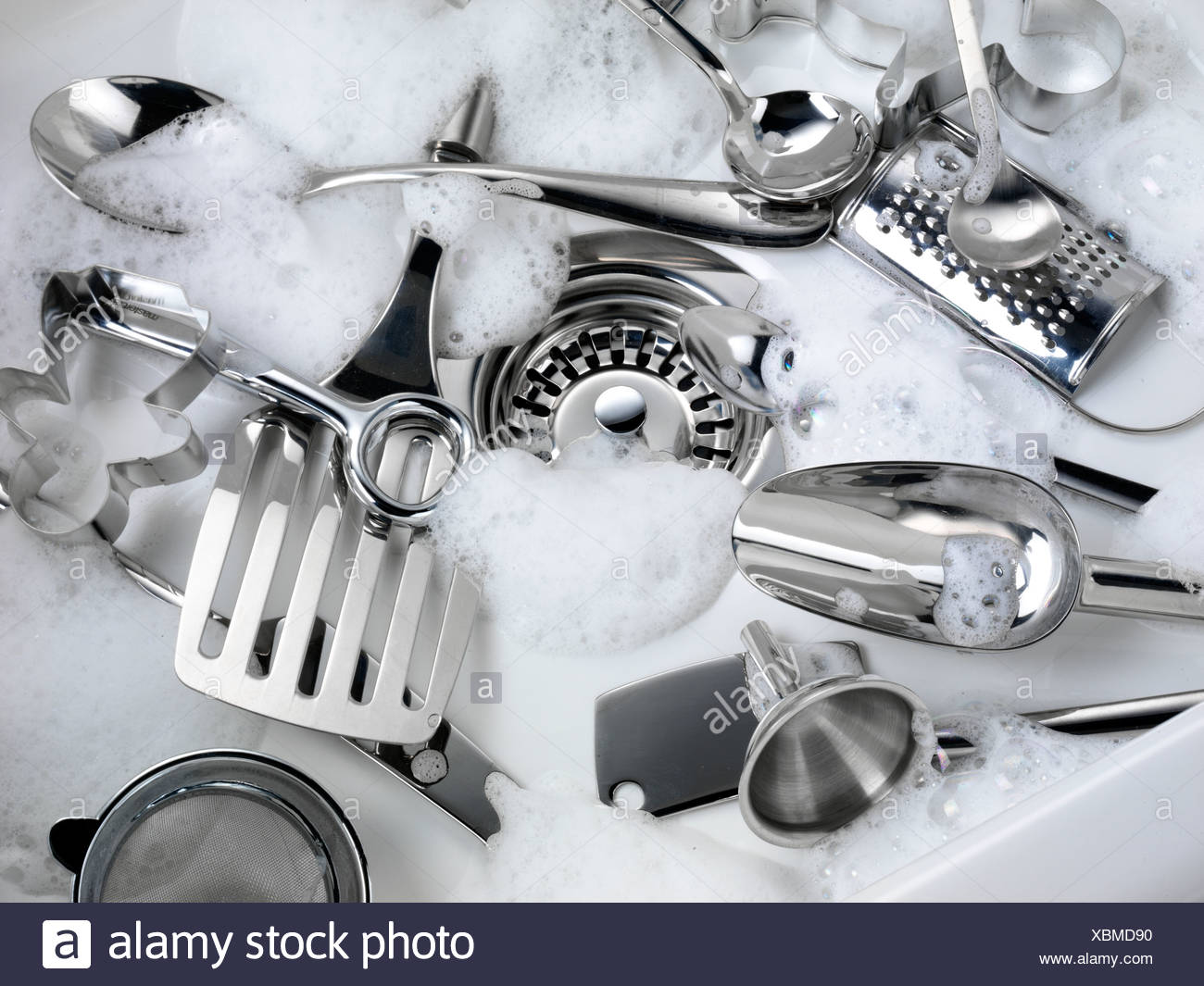 Washing Kitchen Utensils In Sink High Resolution Stock Photography and