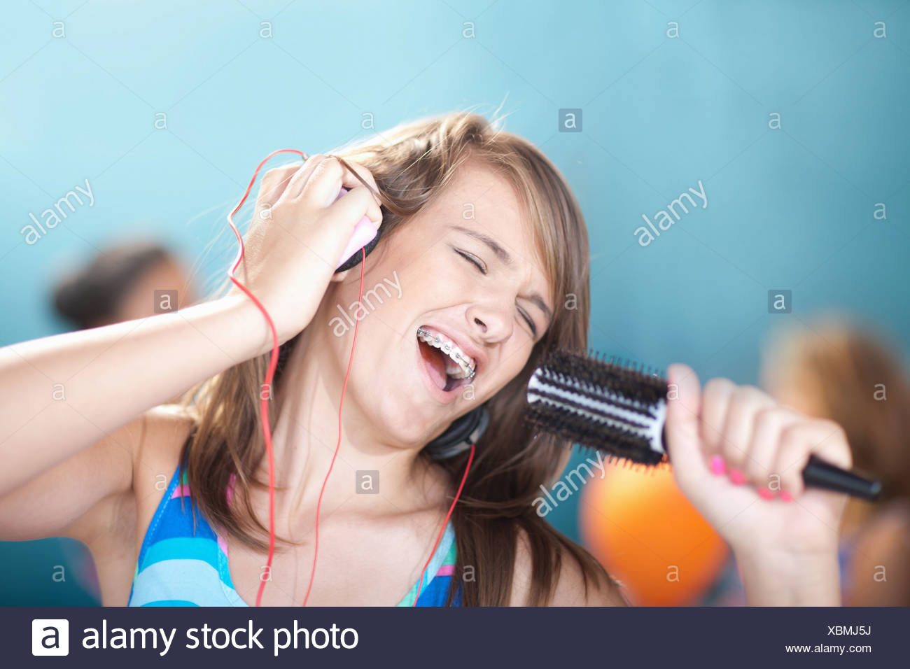 Girl Singing Into Hairbrush High Resolution Stock Photography and ...