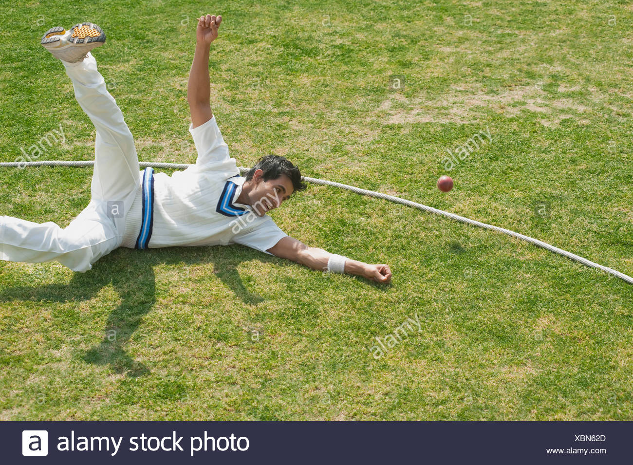 Cricketer Ball Fielder Stock Photos & Cricketer Ball Fielder Stock