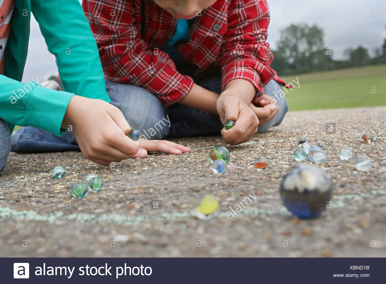 Two Children Playing Marbles Stock Photos & Two Children Playing