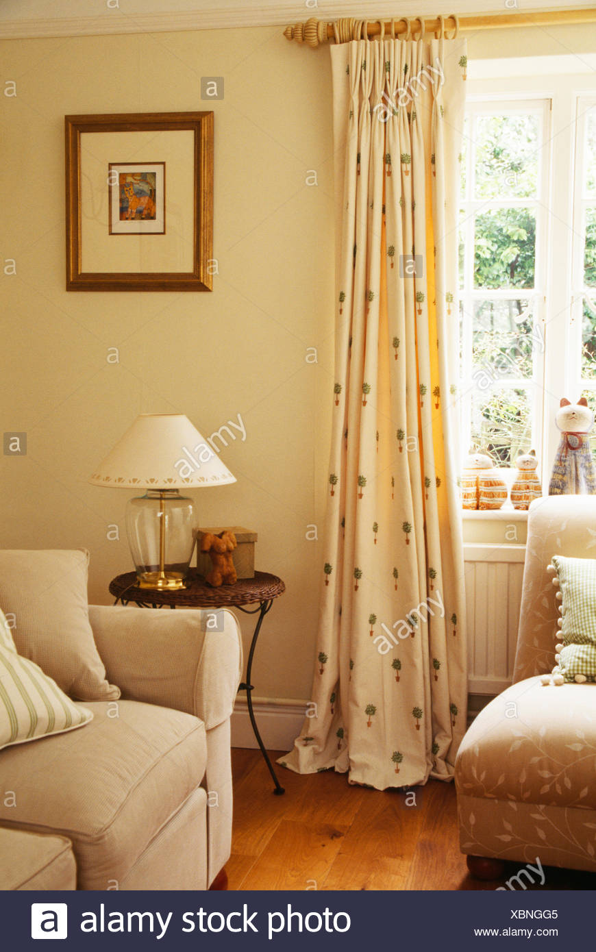 Topiary Patterned Cream Curtains On Wooden Pole On Window In Cream Topiary Patterned Cream Curtains On Wooden Pole On Window In Cream