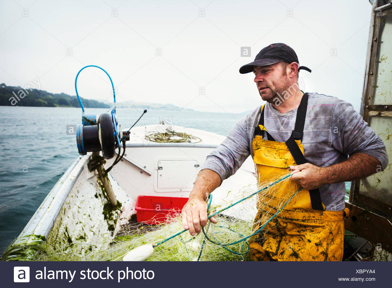 Hauling Net Fishing Boat Stock Photos & Hauling Net Fishing Boat Stock