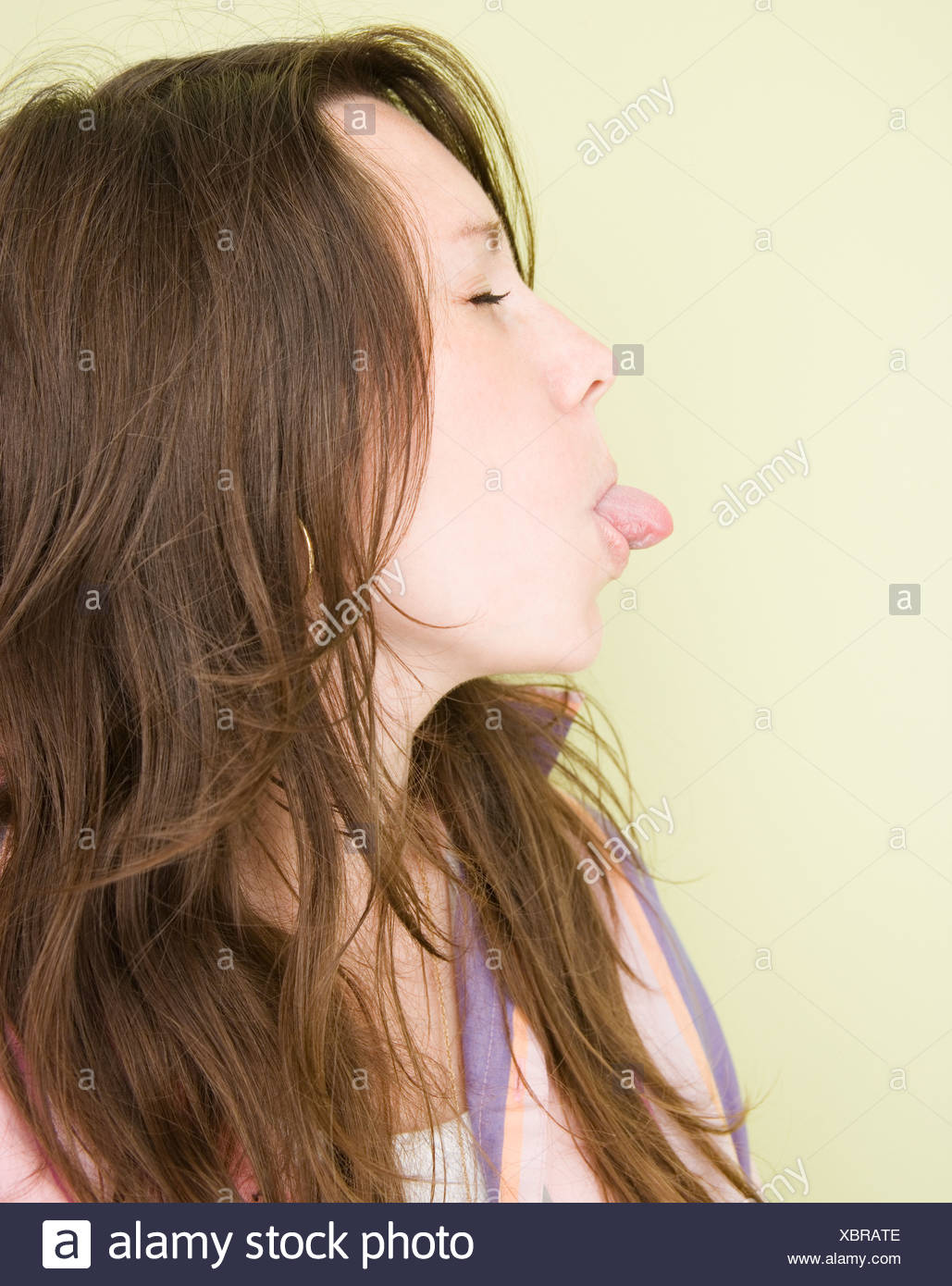 Woman Tongue Sticking Out Side View High Resolution Stock Photography And Images Alamy
