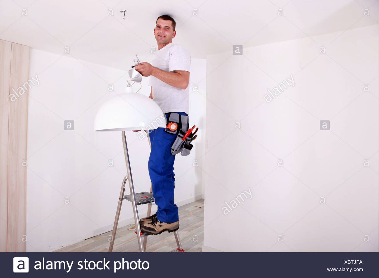 Handy Man Fixing Ceiling Light Stock Photo 282668494 Alamy