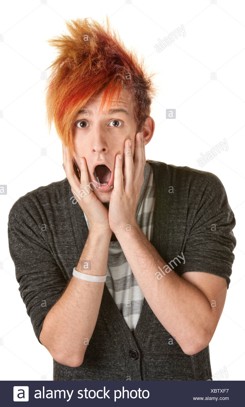 Shocked Man In Orange Spiky Hair Over White Background Stock Photo