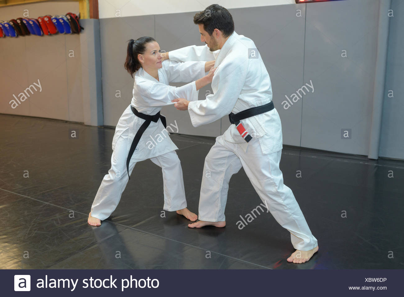Woman And Man Judo Fighters In Sport Hall Stock Photo Alamy
