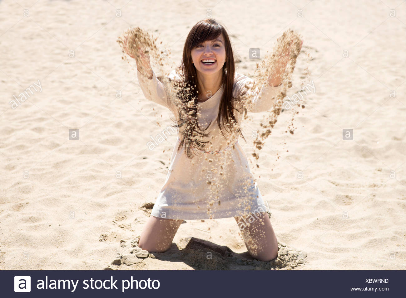 Young Woman Kneeling Beach High Resolution Stock Photography and Images ...