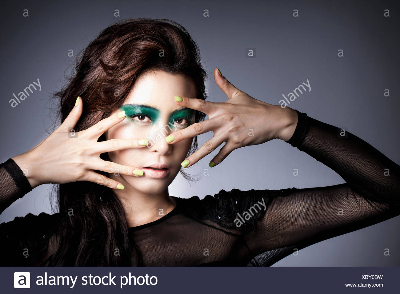 Portrait Of Young Korean Woman With Long Wavy Hair Nd In Black