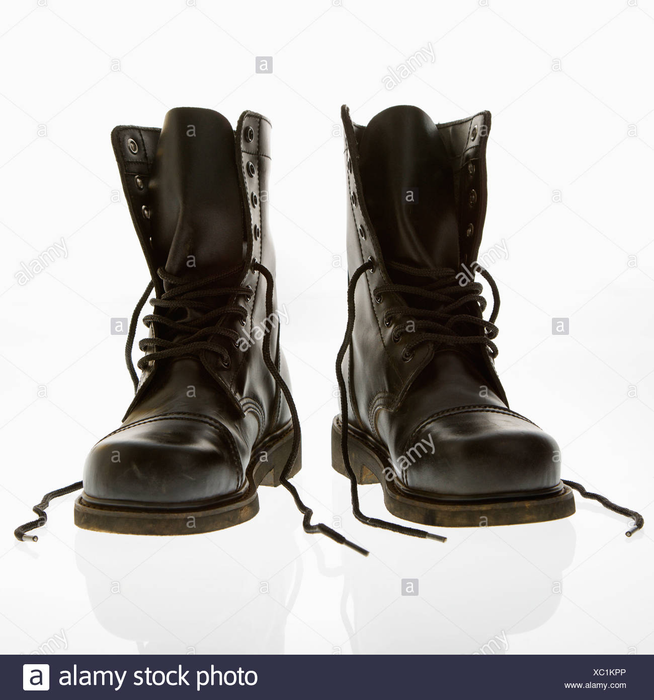 Black leather high top boots with untied laces Stock Photo - Alamy