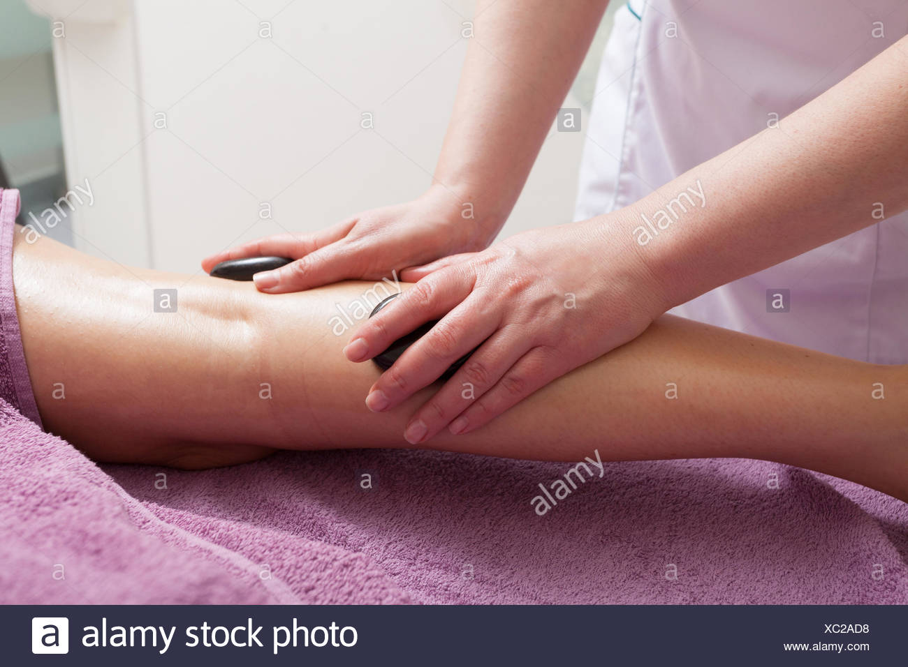 Day Spa Therapist In Work And Female Leg Of Customer Young Woman Relaxing In Healthy Beauty Spa Salon Girl Having Hot Stone Massage Indoor Bodycare And Relax Stock Photo Alamy