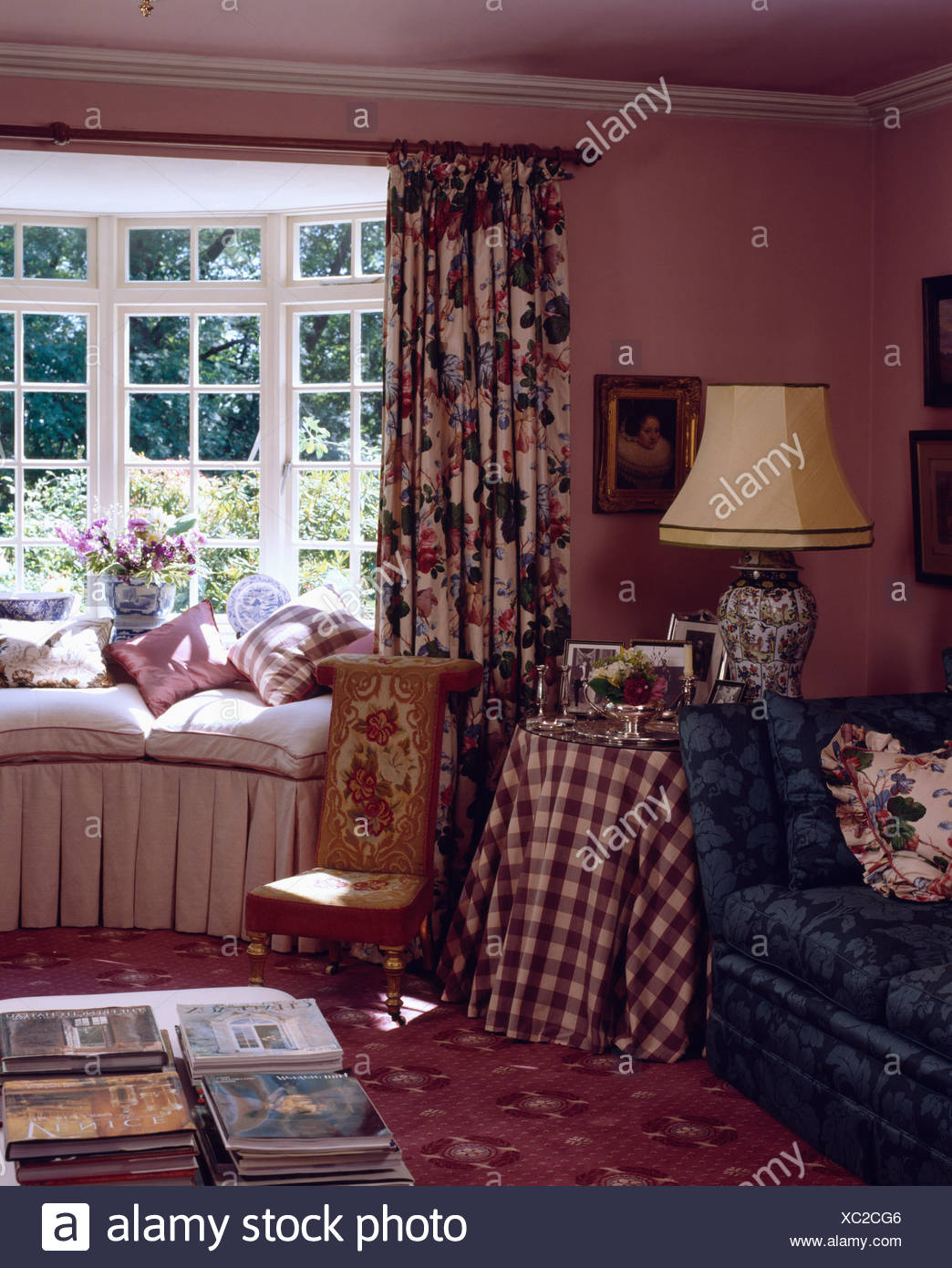 Floral Curtains At Window With Cream Cushions On Window Seat In