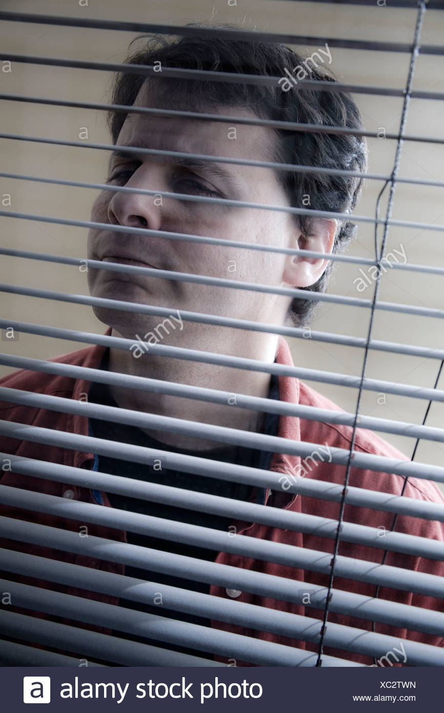 Man Looking Through His Office Window Blinds Stock Photo Alamy