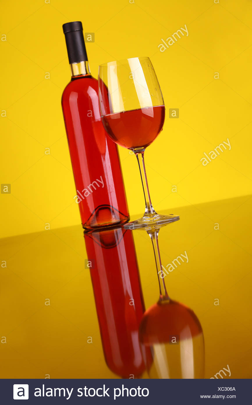 Download Glass And Bottle Of Rose Wine Over A Yellow Background Stock Photo Alamy Yellowimages Mockups