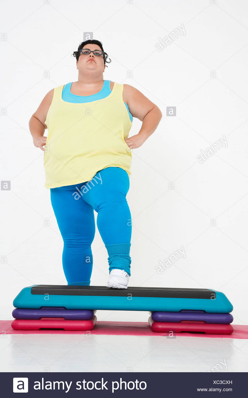 Plus-Size Woman on Exercise Steps Stock 