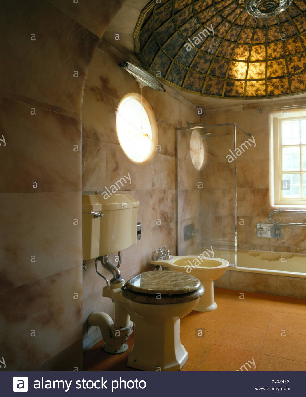 Stained Glass Domed Ceiling Above Bath With Glass Shower Cabinet