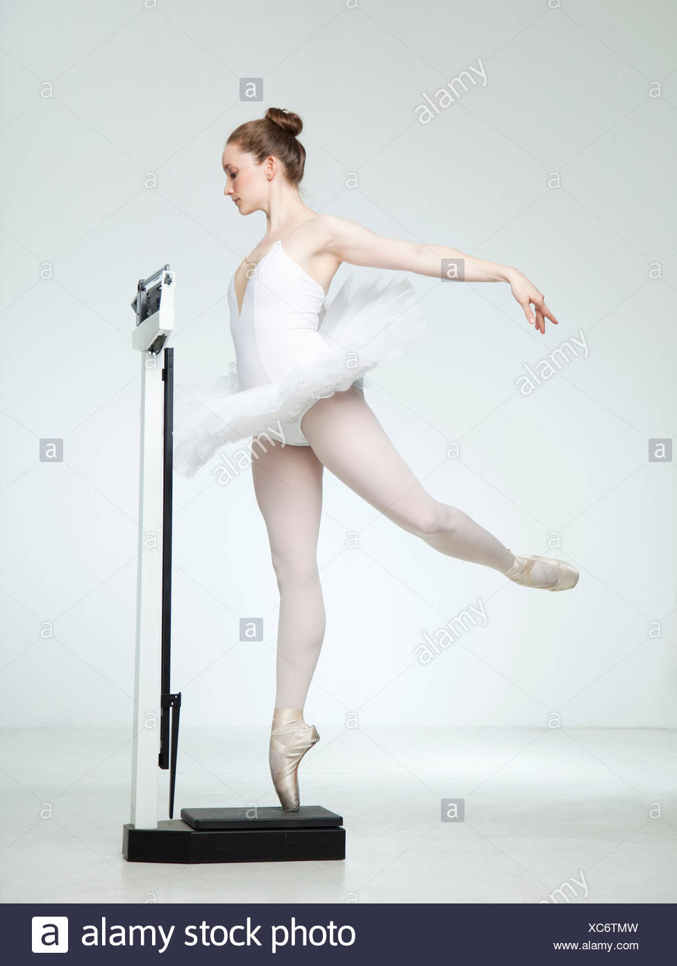 Studio shot of ballet dancer dancing on weight scale Stock Photo - Alamy