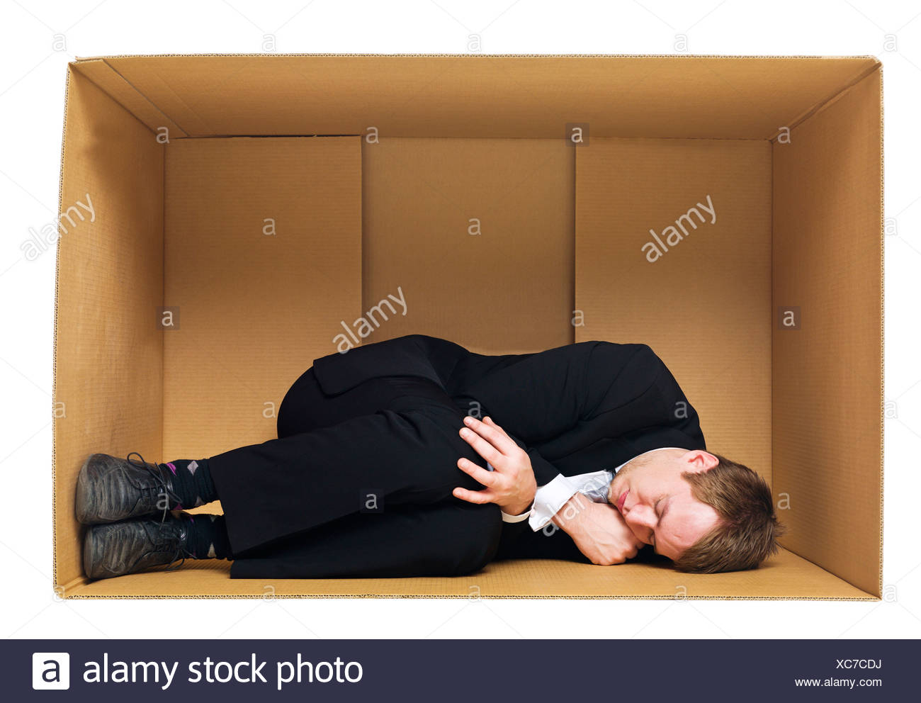 Man Sleeping Inside Cardboard Box Stock Photos & Man Sleeping Inside Cardboard Box Stock Images