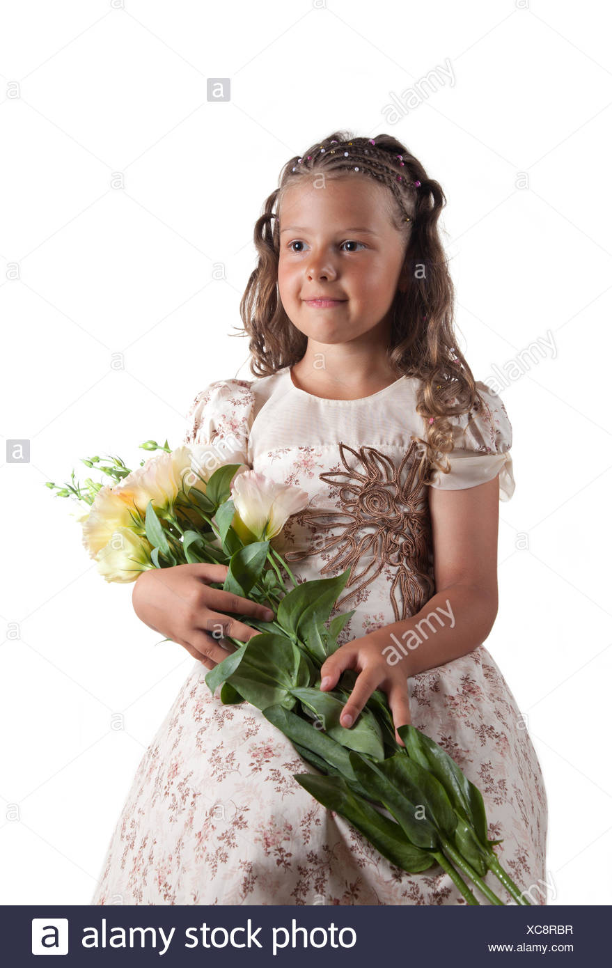 Cute Little Girl With Pigtail Hairstyle Holding Flowers Stock