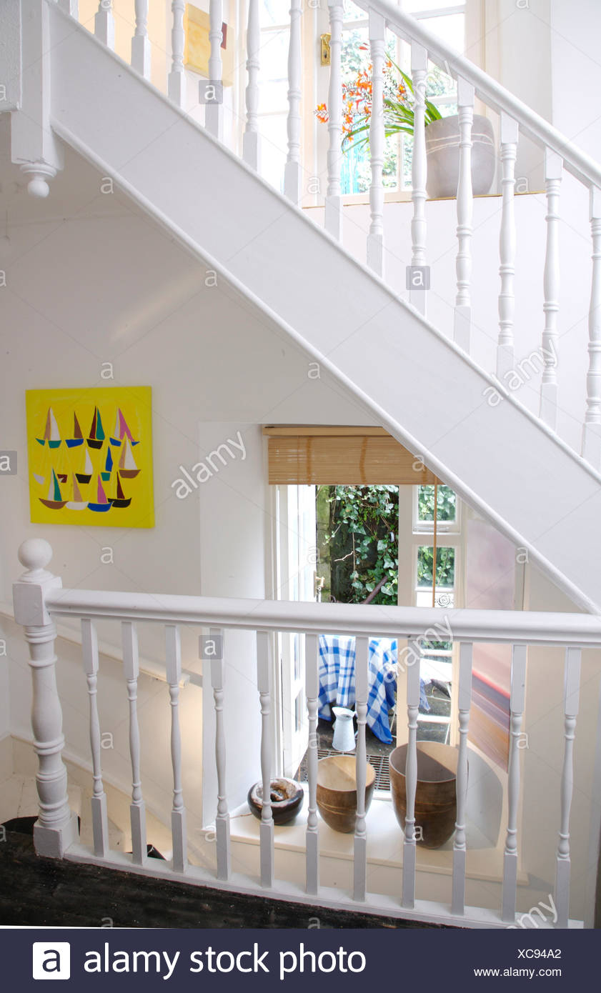 White Painted Staircase And Banisters On Coastal Cottage Landing