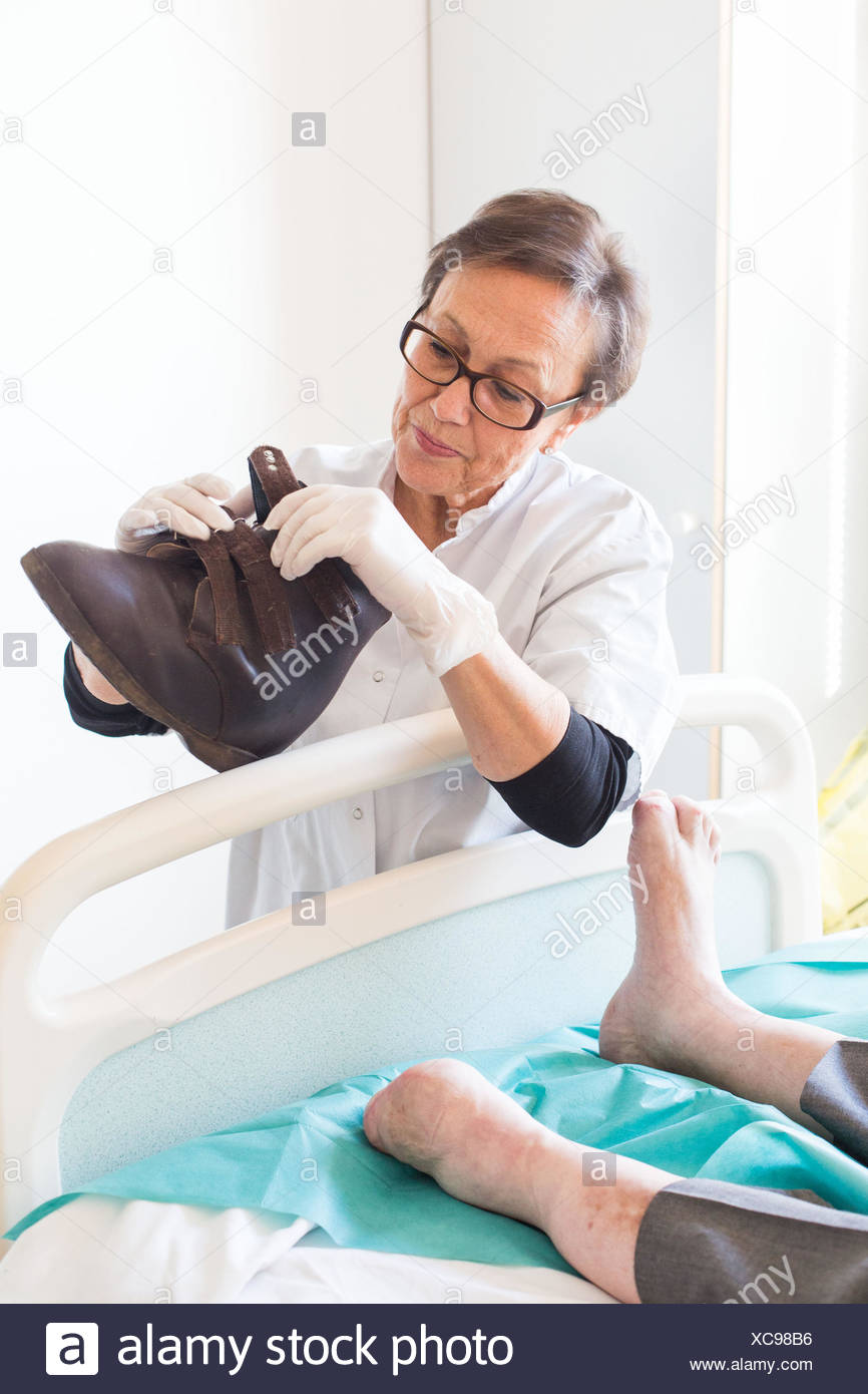 orthopedic high resolution stock photography and images alamy https www alamy com podiatrist examining the orthopedic shoe of a diabetic patient angouleme hospital france image282945914 html