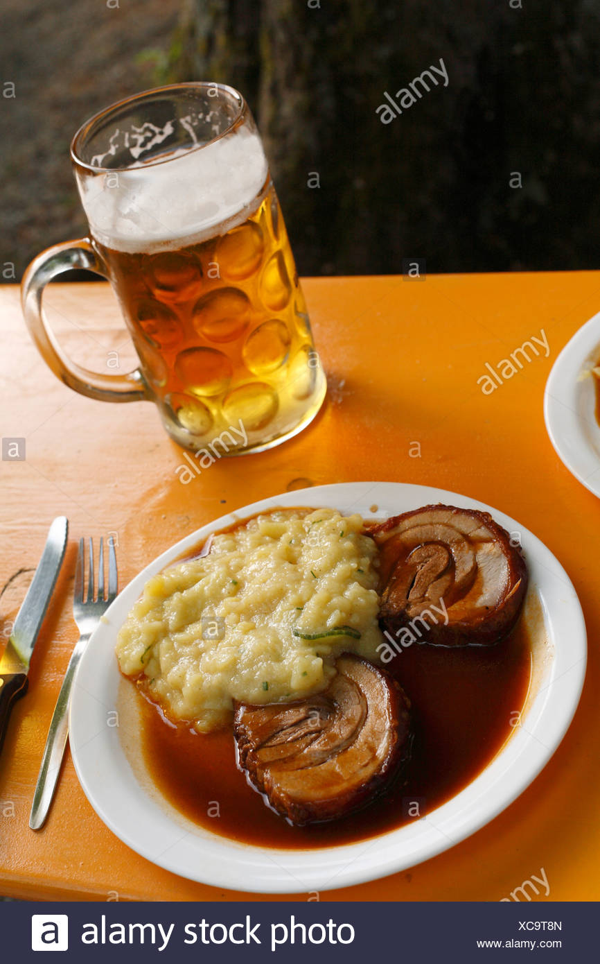 Roast Pork With Potato Salad Beer In A Beer Jug Munich Bavaria Germany Europe Stock Photo Alamy