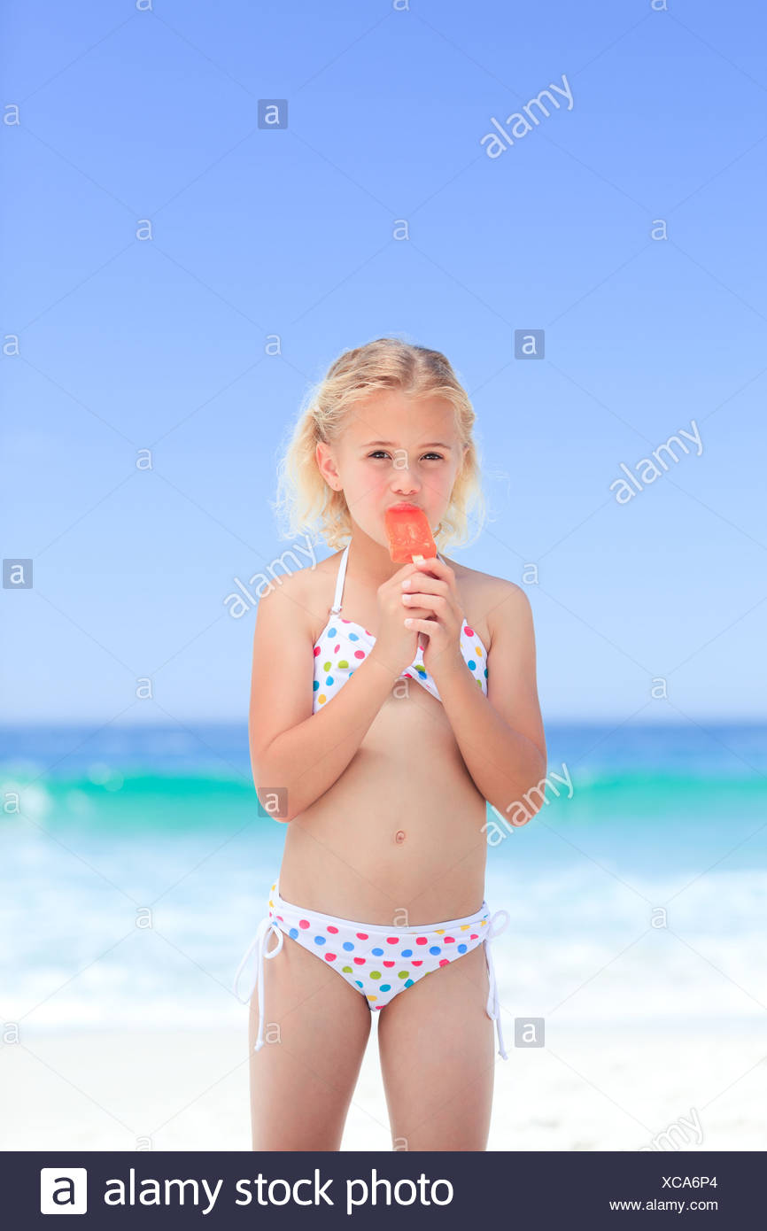 Little Girl Eating Her Ice Cream Stock Photo Alamy