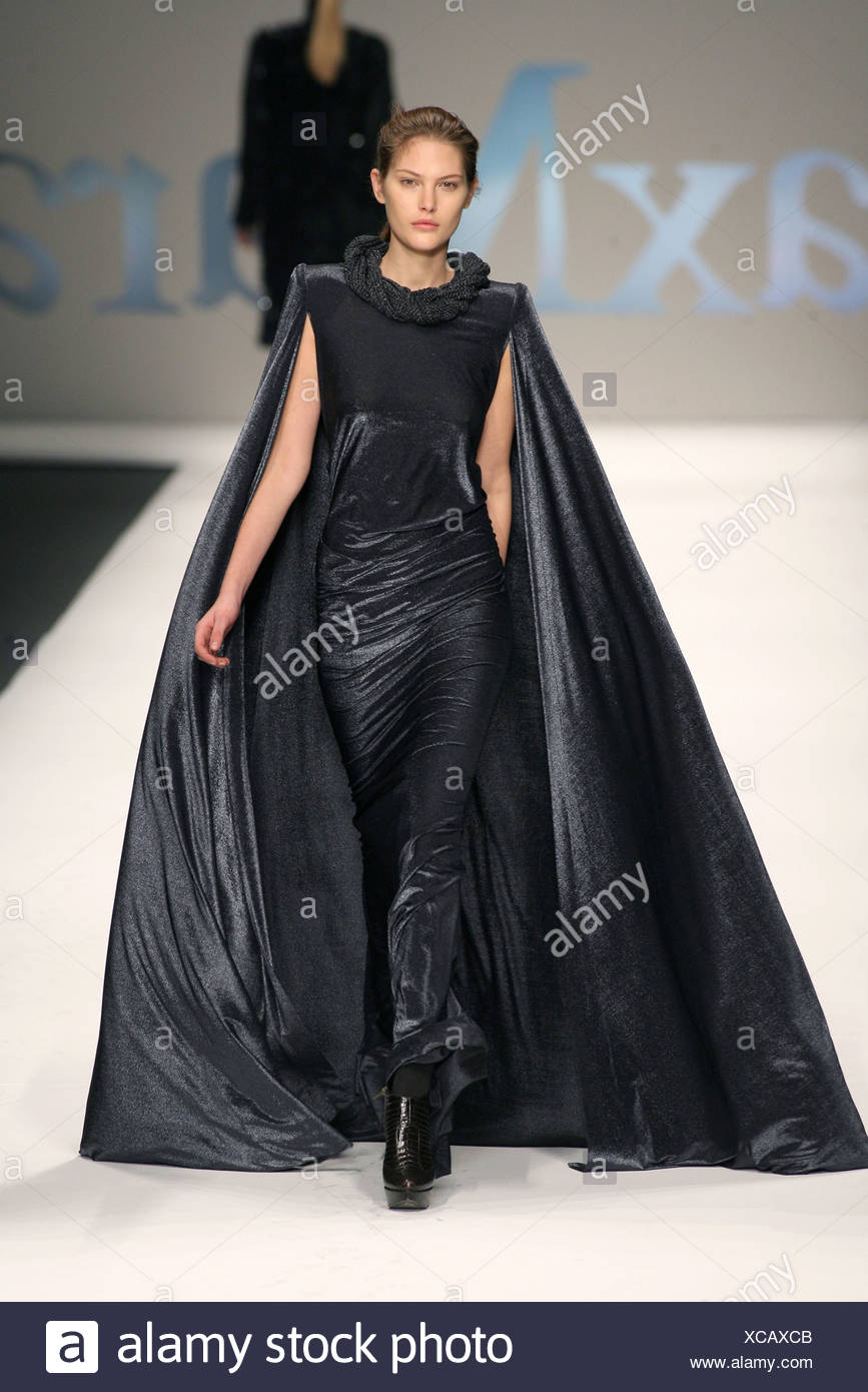 Max Mara Milan Ready to Wear Autumn Winter Metallic black figure hugging long  dress with big floor length cape Stock Photo - Alamy