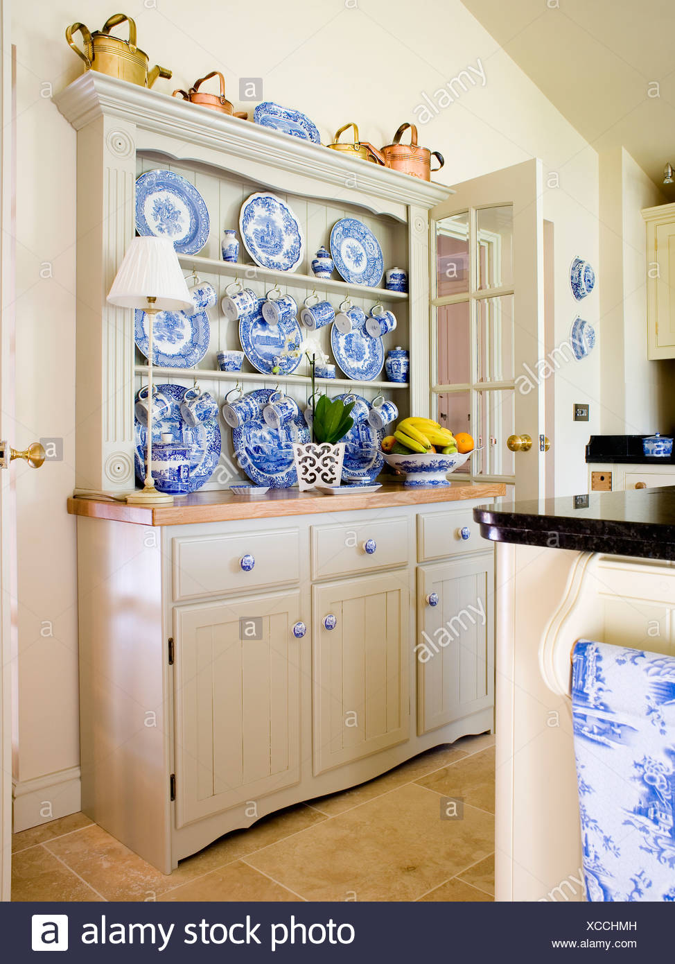 Collection Of Blue White China On Fitted Cream Dresser In Country