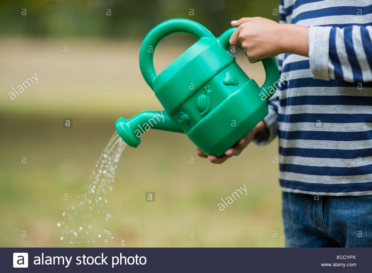 Boy Pouring Water High Resolution Stock Photography and Images Alamy