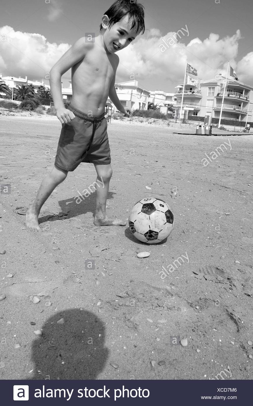 Boy Playing Soccer On The Beach Stock Photo Alamy