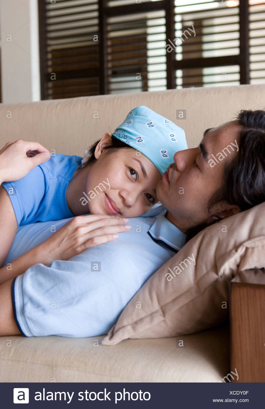 Couple Snuggling On Couch Stock Photos Couple Snuggling On Couch