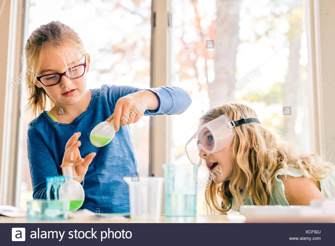 Girls Doing Science Experiment High Resolution Stock Photography and ...