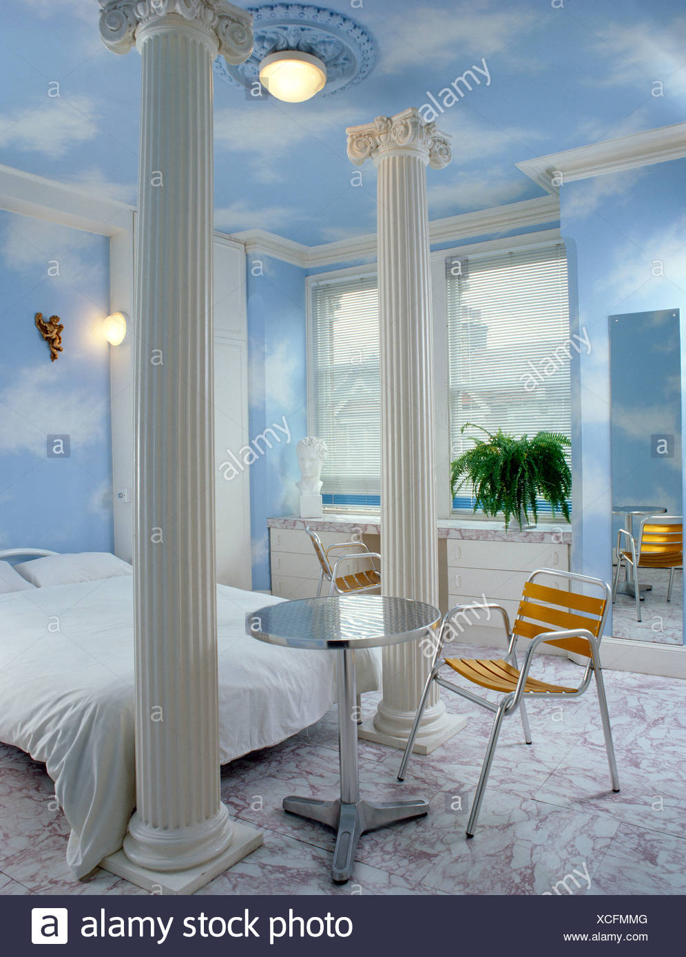 S Bedroom Interiwith Fake White Columns Metal Table And