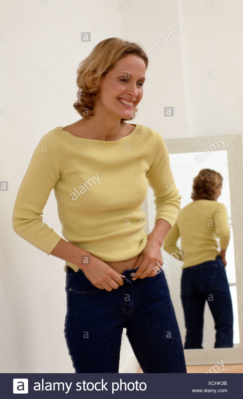 yellow jumper blue jeans