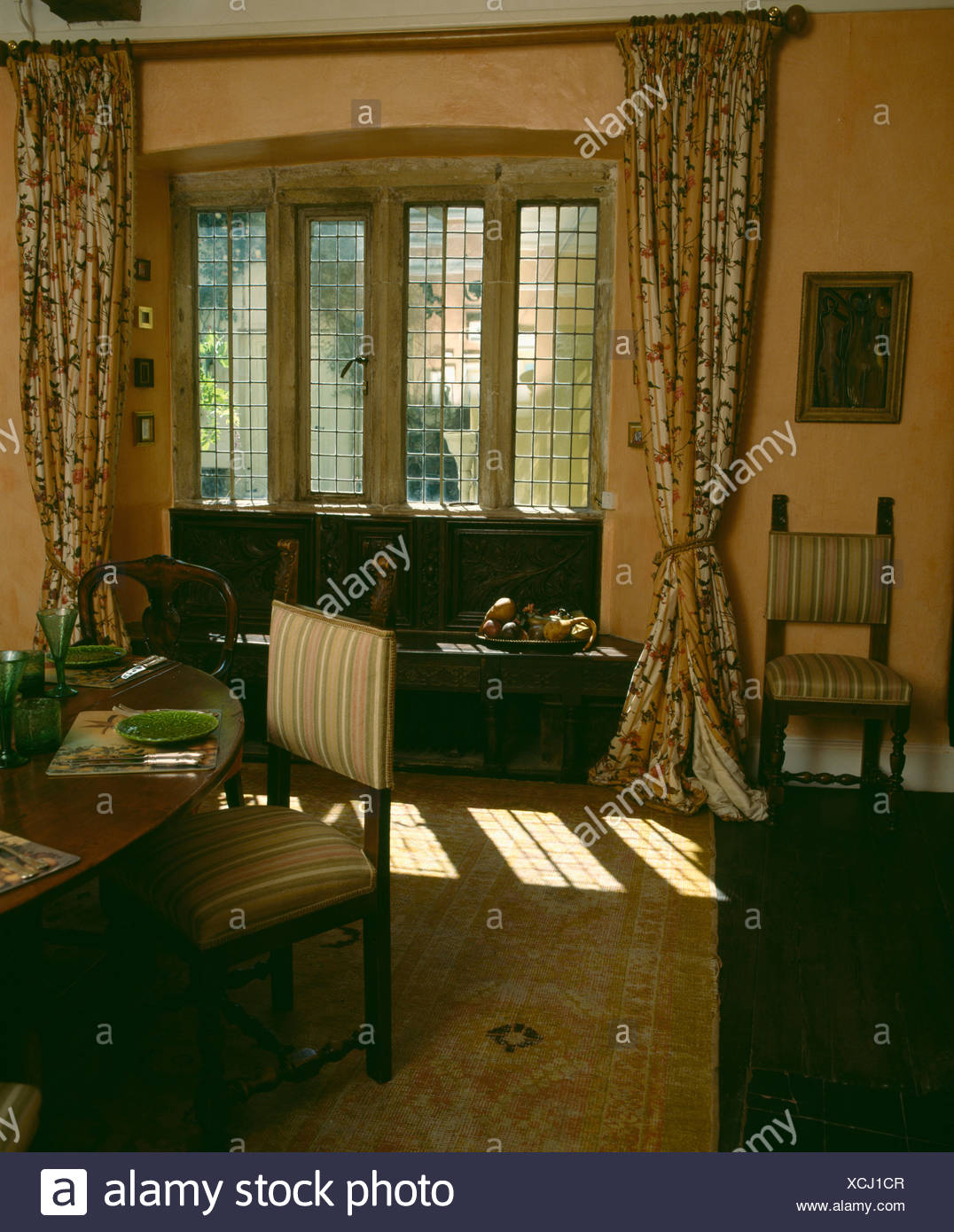 Floral Curtains On Window With Window Seat And Stone Lintels In