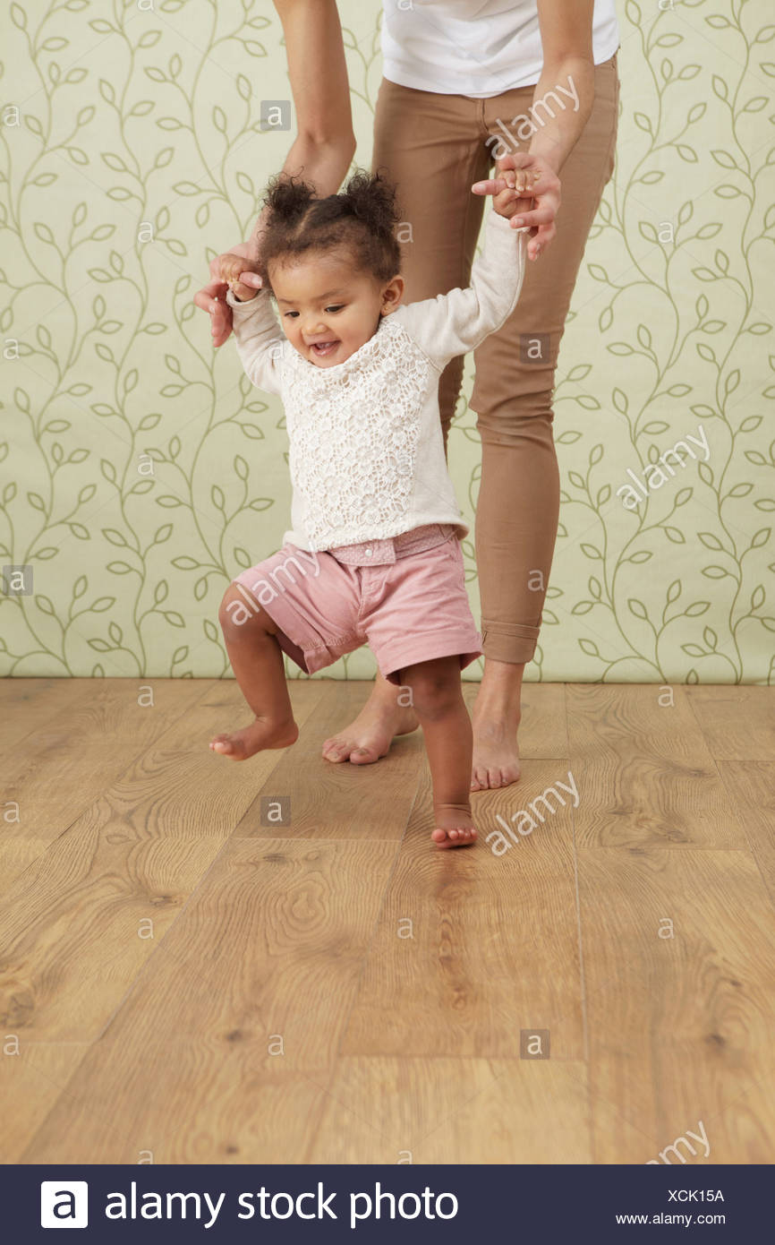baby taking first steps