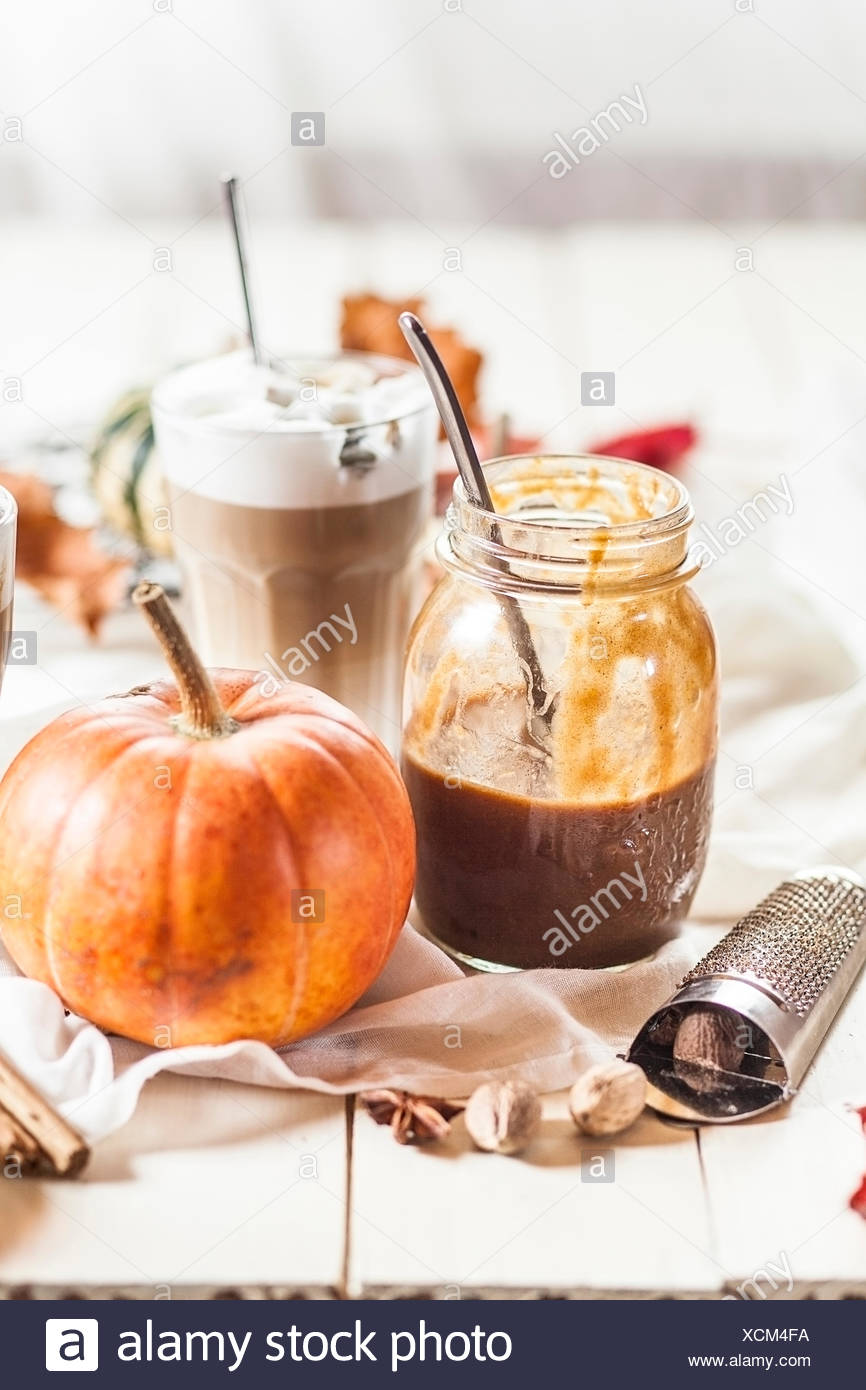 Glass Of Pumpkin Spice Latte Syrup Latte Macciato And Mini Pumpkin In Between Autumnal Decoration Stock Photo Alamy