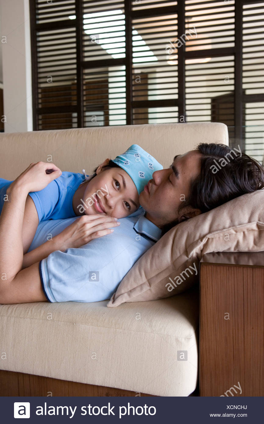 Couple Snuggling On Couch Stock Photos Couple Snuggling On Couch