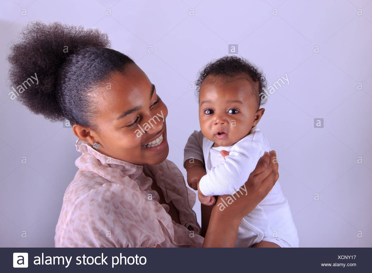 Attractive African American Mother Holding Newborn Baby Boy Stock