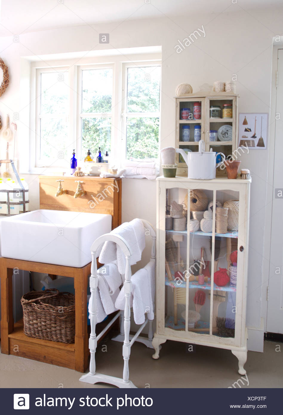 Small Glass Fronted Cupboard And White Towel Rail With White