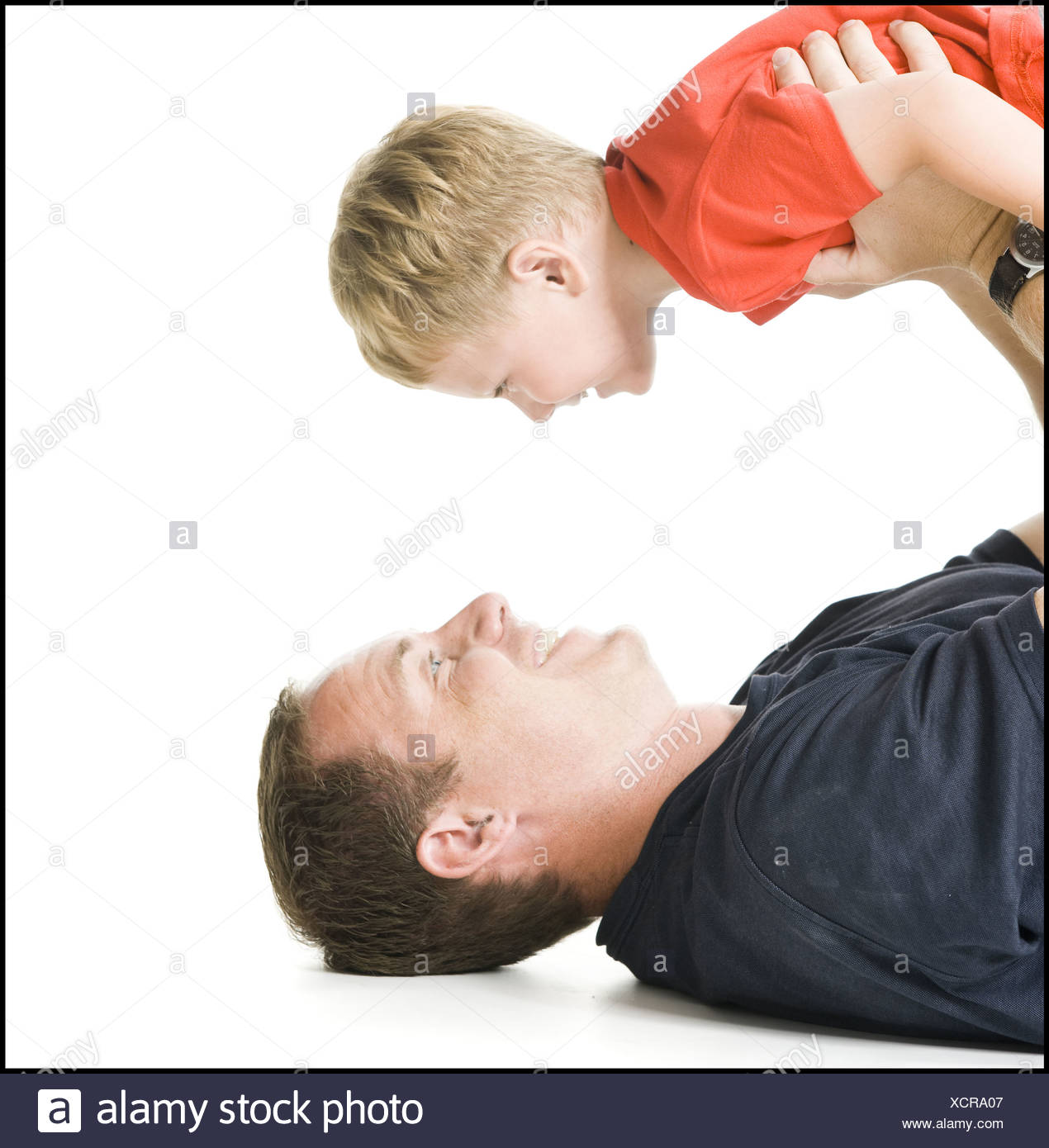 Parents Holding Kids Upside Down High Resolution Stock Photography and