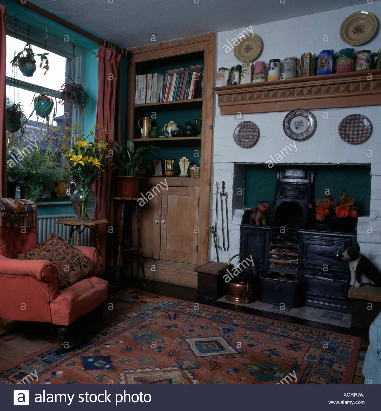 Pottery Jugs On Wooden Shelf Above An Victorian Stove In A