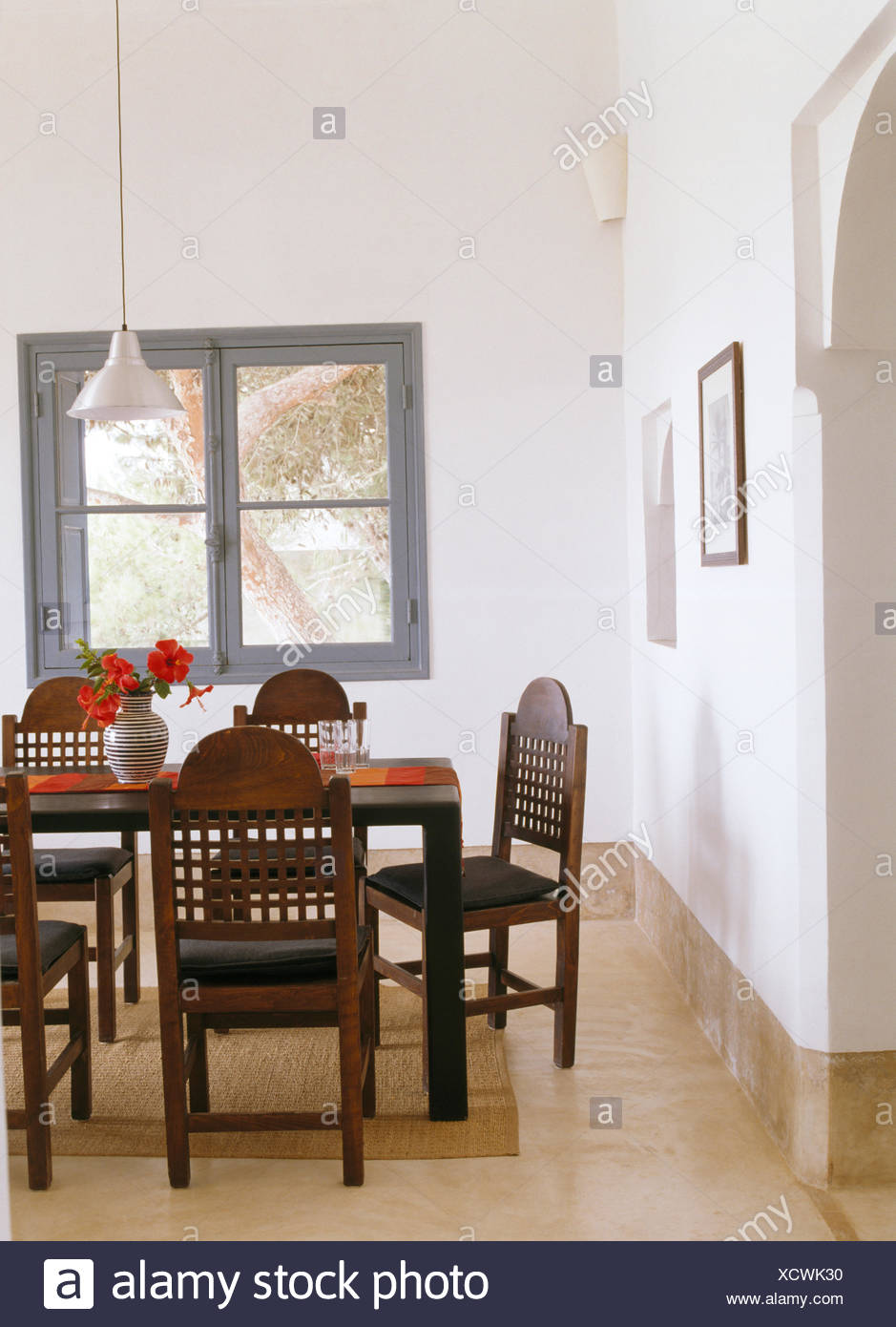 photo Moroccan Dining Table And Chairs https www alamy com fretwork backs on chairs at simple table in modern white moroccan dining room with marble flooring image283305540 html
